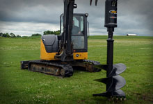 Excavator with a Digga 12DDS Auger Drive and Auger Bit.