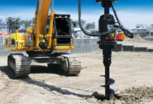 Excavator with a Digga SD (Supa Drive) and Digga Auger Bit for drilling.