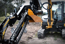 Excavator with a Digga Bigfoot Trencher.