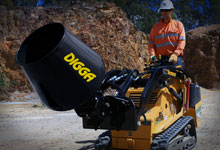 Mini loader mixing cement with a Digga Cement Mixer.