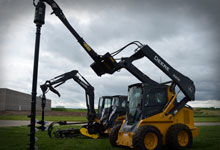 Skid steer loaders with a Digga TPE (Drilling & Piling Extension), Digga Auger Bit Extension, and a Digga Bigfoot Trencher.