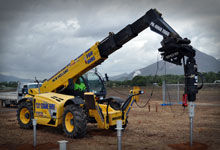 Telehandler installing piles with a Digga Premium drive unit.